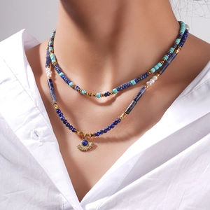 Lapis lazuli layered necklace with gold fan pendant and pearls for a boho look