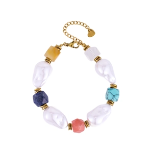 Close-up of bohemian beaded necklace with baroque pearls, colorful stones and heart pendant