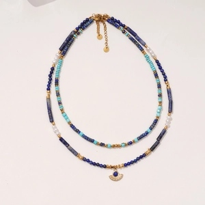 Double-layered lapis lazuli and turquoise beaded necklace with golden fan pendant