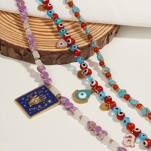 Handmade natural stone beaded necklaces featuring Evil Eye and Hamsa Hand charms