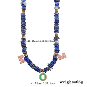 Detailed view of lapis lazuli beaded necklace with gold MOM letter charms and sizing info
