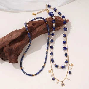 Lapis lazuli and pearl necklace set with star pendant on elegant rustic wood background