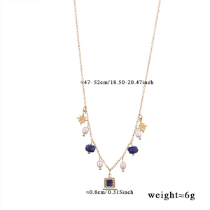 Detail of beaded necklace with gold star, blue stone, pearl and 47-52cm size dimensions