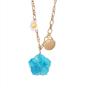 Stainless steel necklace featuring Hamsa hand, shell and blue flower pendants
