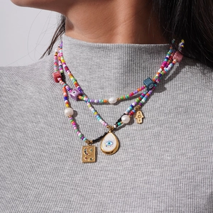 Bohemian multilayer seed bead necklace with evil eye and hand of fatima pendants