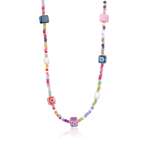 Detail view of Bohemian evil eye necklace with colorful seed beads and pearls