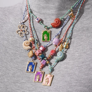 Bohemian multi-layer braided cord necklace with shells and colorful evil eye pendants