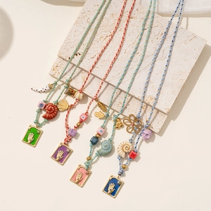 Bohemian Hamsa Hand and Evil Eye cord necklace with shell and colorful resin beads