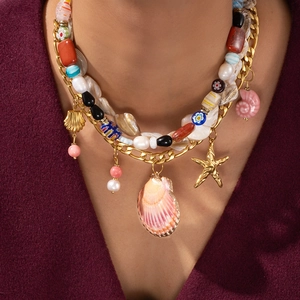 Bohemian multi-layer necklace with large pink seashell and starfish on gold Figaro chain