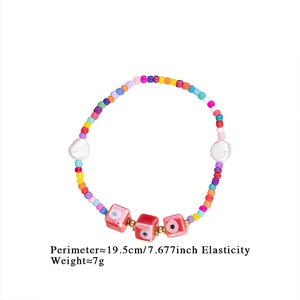 Detail of colorful beaded bracelet with evil eye charms, 19.5cm length and 7g weight