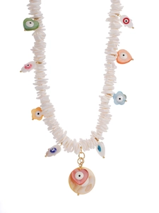 Detailed view of bohemian beaded necklace with white shell discs and evil eye charms