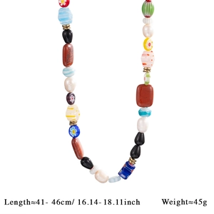 Detail of colorful bohemian beads, fresh water pearls and natural stones on the necklace