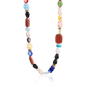 Detail of bohemian Figaro chain necklace with colorful glass beads and natural pearls