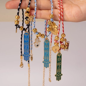 Handmade woven Hamsa Hand and Evil Eye pendant necklaces with multi-color cords and charms