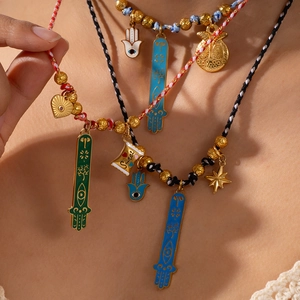 Bohemian Hamsa Hand and Evil Eye necklace with woven cord and gold bead chain layers