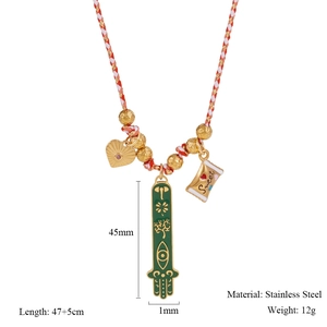 Macro view of woven necklace featuring green Hamsa pendant and Evil Eye symbol detail