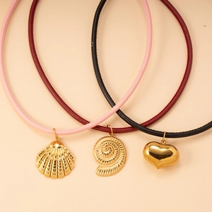 Three-piece set of leather cord necklaces featuring gold heart, shell, and conch pendants