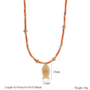 Detail of beaded fish necklace with natural stone pendant and adjustable chain length