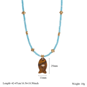 Detail of light blue beaded fish necklace with size labels 42-47cm and 25x11mm dimensions