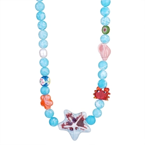 Colorful ocean-themed beaded necklace with sea star, crab charms and blue stone beads