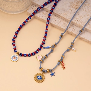 Bohemian beaded necklaces with evil eye charms, sun flower and sea star pendants