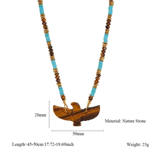 Detailed view of tiger eye stone eagle pendant with turquoise beads and size markings