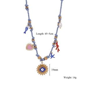 Detail of beaded necklace with evil eye pendant, blue fish, and pearls, 45+5cm length