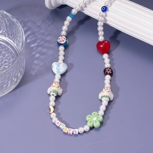 Colorful beaded necklace with pearls, heart charms and ANGEL letter beads in Y2K style