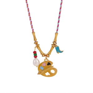 Artistic pendant necklace with colorful braided cord, golden palette and baroque pearls