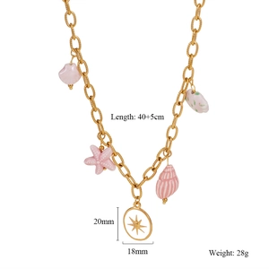 Close-up of gold chain necklace featuring starfish and pink shell ocean-themed charms