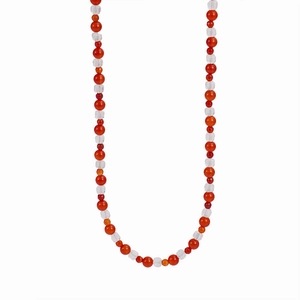Detail of red agate and clear crystal beads necklace showing smooth texture and luster