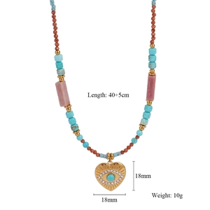 Detail of beaded evil eye heart necklace with turquoise stones and dimensions text