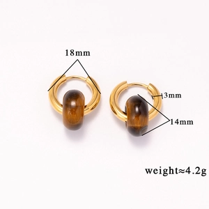 Macro detail of 18k gold plated stainless steel hoops with brown tiger eye stone beads