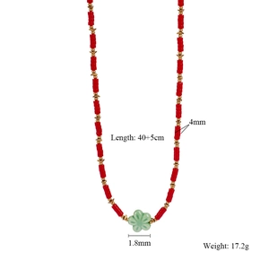 Detail of red beaded necklace with green flower pendant and 40+5cm length specs