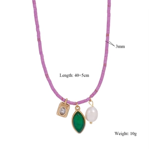 Detail of beaded purple necklace with gemstone charms and dimensions 40 plus 5cm length