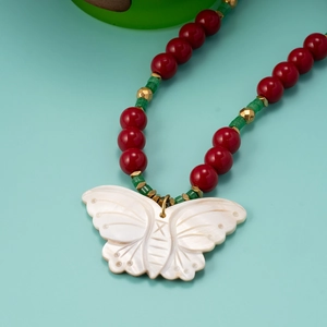 Ethnic beaded necklace with white shell butterfly pendant and red green beads