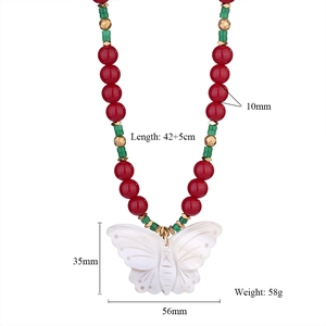 Detail view of ethnic beaded necklace with white butterfly pendant and size specifications