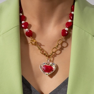 Beaded heart and pearl necklace with a real rose in heart-shaped glass pendant