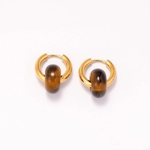 Detail of 18k gold plated stainless steel hoops with brown tiger eye stone texture beads