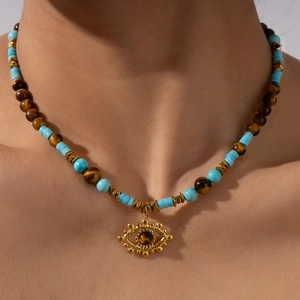Ethnic Evil Eye pendant necklace with blue turquoise beads and brown tiger eye stones