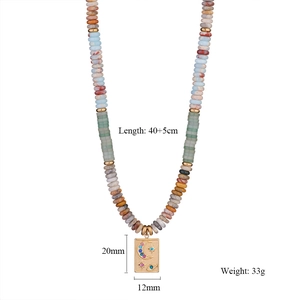 Detail of beaded necklace with celestial pendant showing 40+5cm length and dimensions