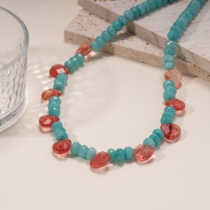 Colorful beaded necklace with sky blue round stones and orange teardrop crystals for parties