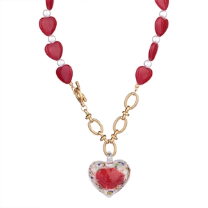 Golden chain necklace with red heart beads, white pearls, and a rose heart pendant