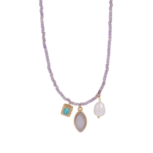 Detail of freshwater pearl, turquoise, and purple stone pendants on beaded necklace