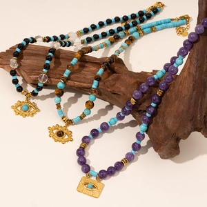 Bohemian Evil Eye pendant necklace with blue turquoise and tiger eye stone beads
