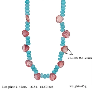 Detail of beaded necklace with sky blue faceted beads and reddish-brown heart gemstones