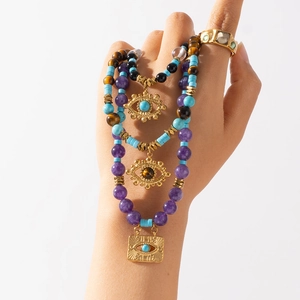 Bohemian evil eye necklaces set with amethyst, turquoise, and tiger eye beads
