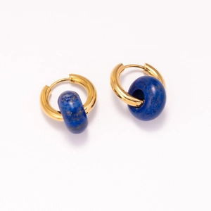 Detail of 18k gold plated hoop earrings featuring natural blue lapis stone textures