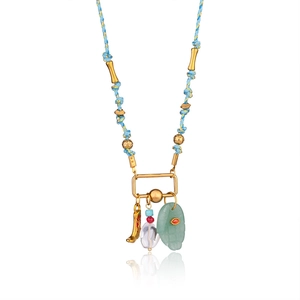 Macro view of blue braided cord necklace with 18k gold palm eye and natural stone pendants