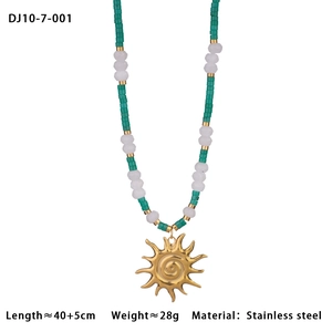 Detail view of stainless steel beaded necklace with sun pendant, 40+5cm length shown